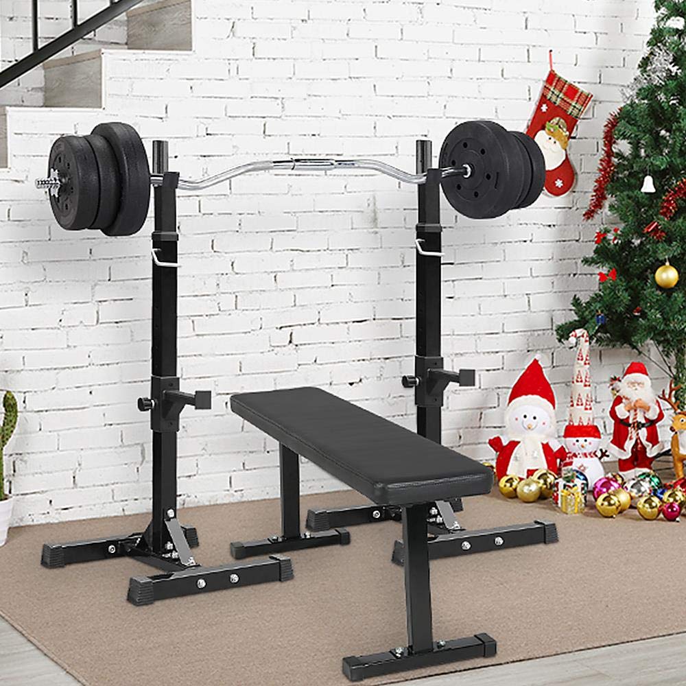 Gym bench and weight rack with Christmas decorations in the background