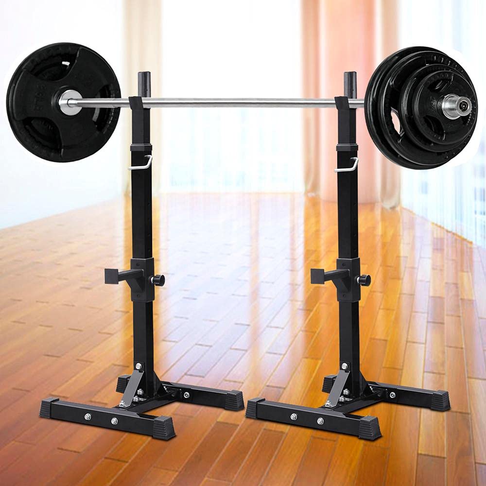 Weight lifting stand with barbell and weights on a wooden floor.